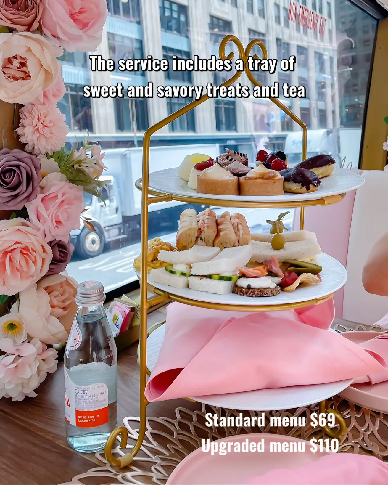  A tray of sweet and savory treats and tea are served on a table.