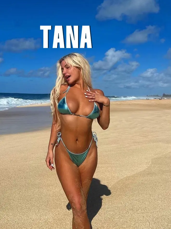  A woman in a bikini is standing on a beach.