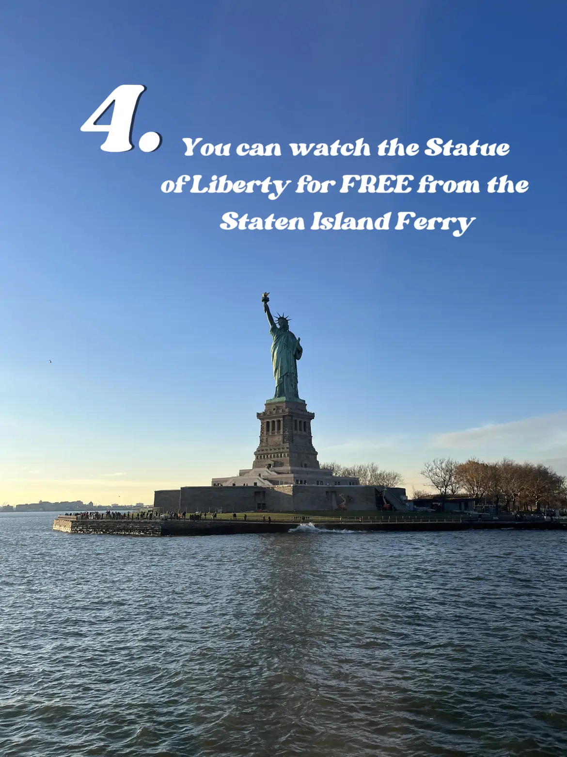  The image shows a view of the Statue of Liberty from the Staten Island Ferry.