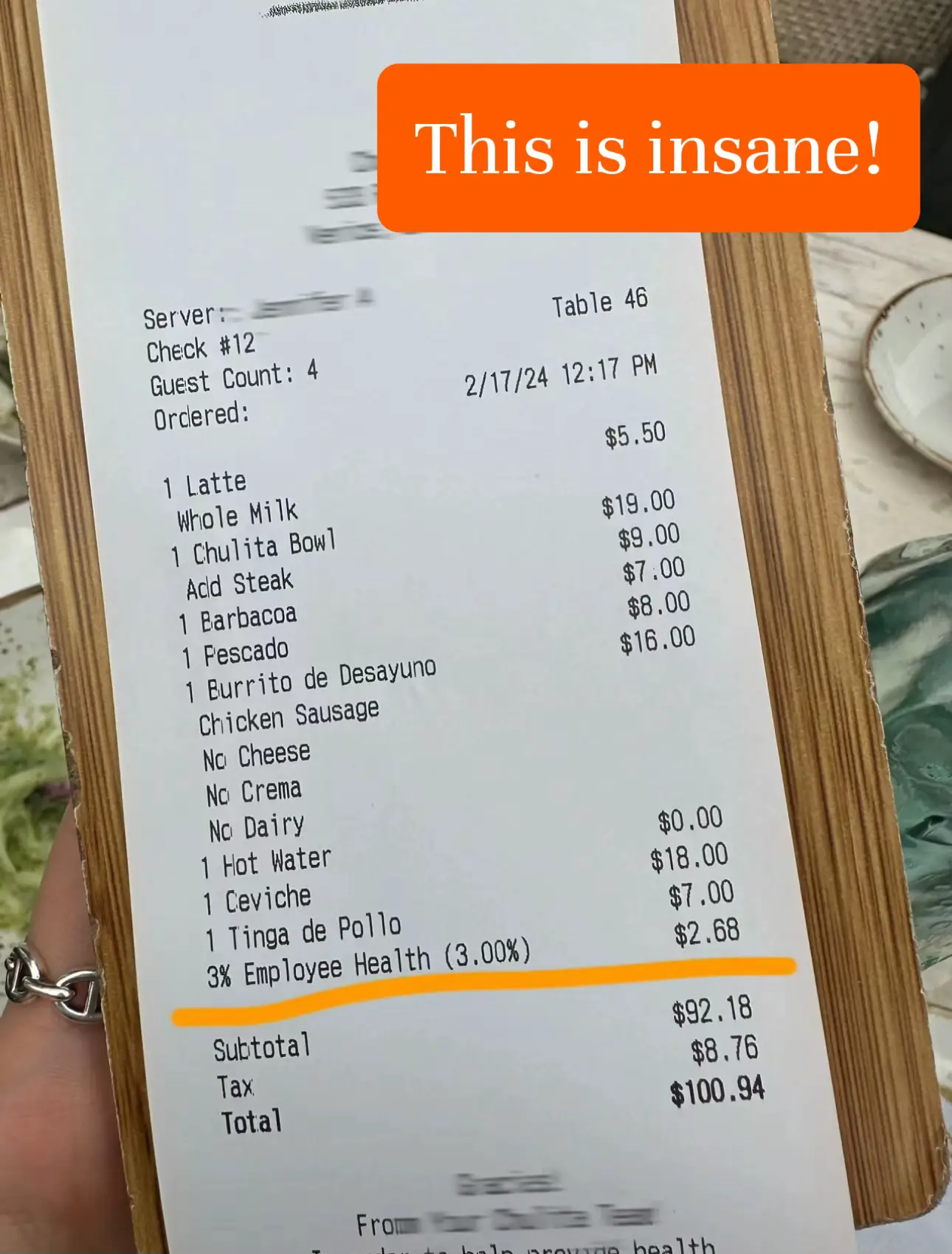 A receipt for a meal at a restaurant with a $3.00 employee health plan.