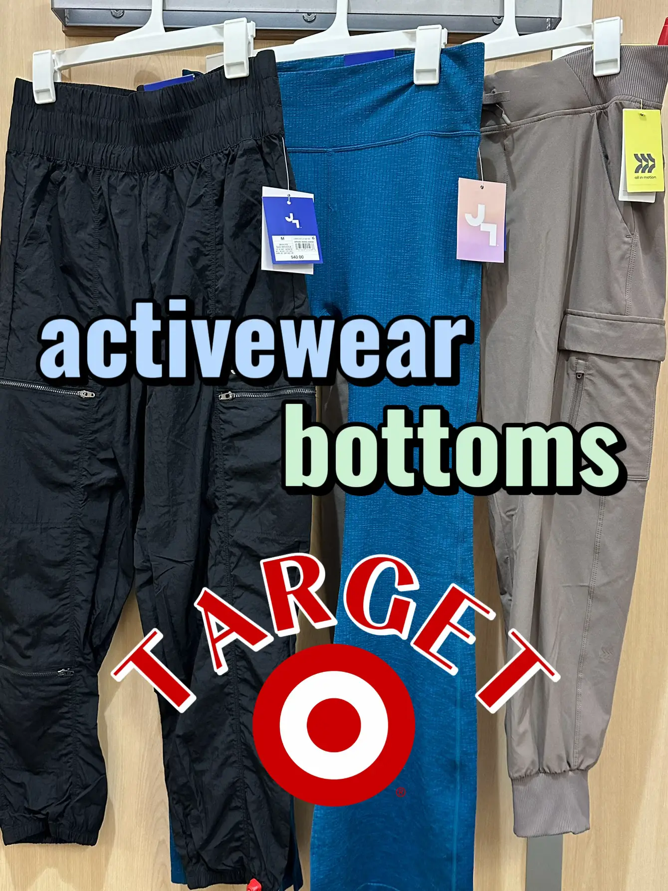  Two pairs of activewear bottoms are displayed on a rack.