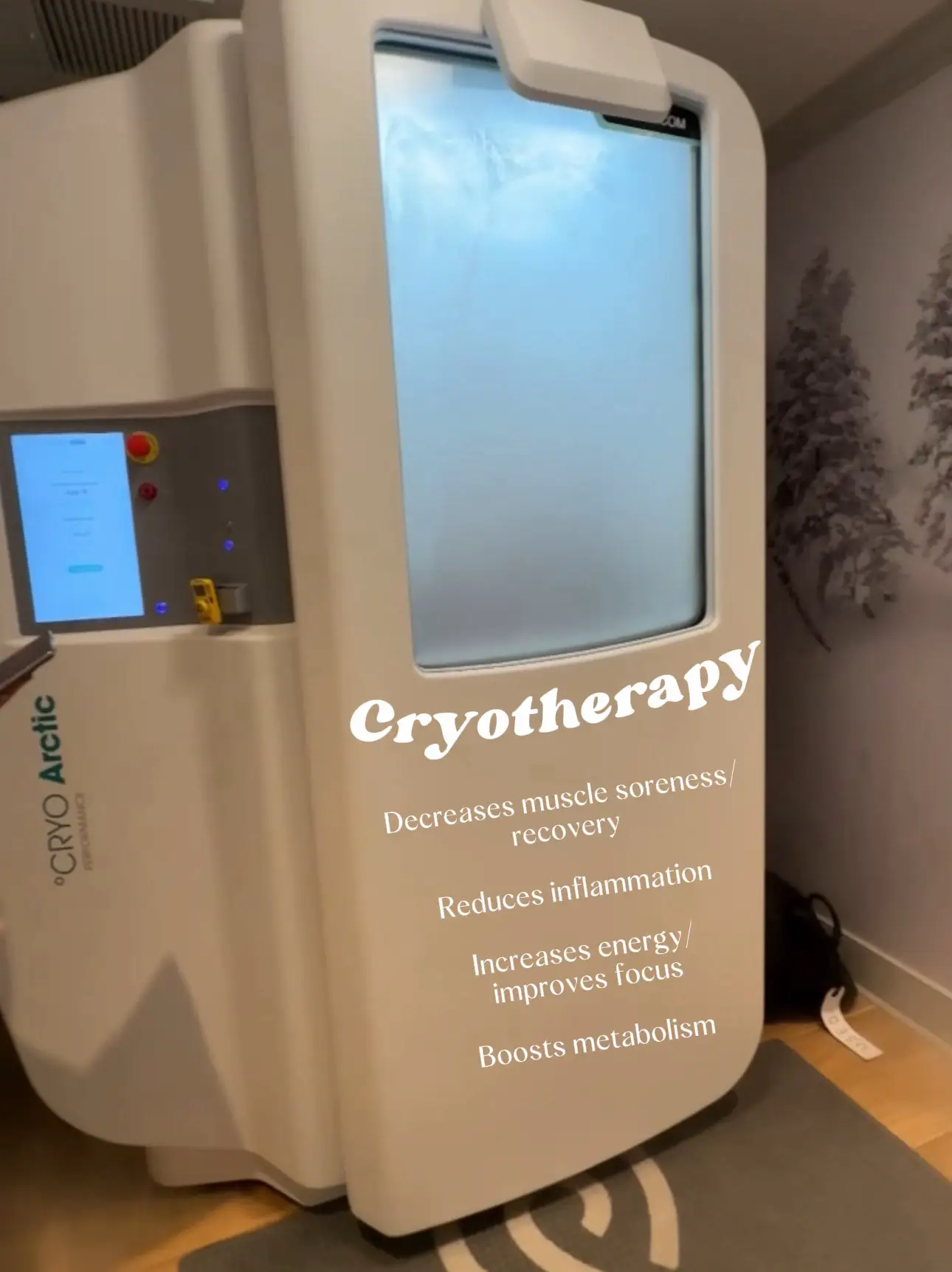  A room with a cryotherapy machine on the wall.