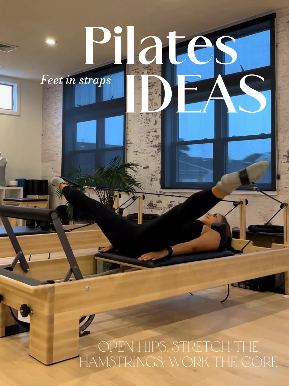 Practicing Pilates with feet in straps. - Bern Pilates