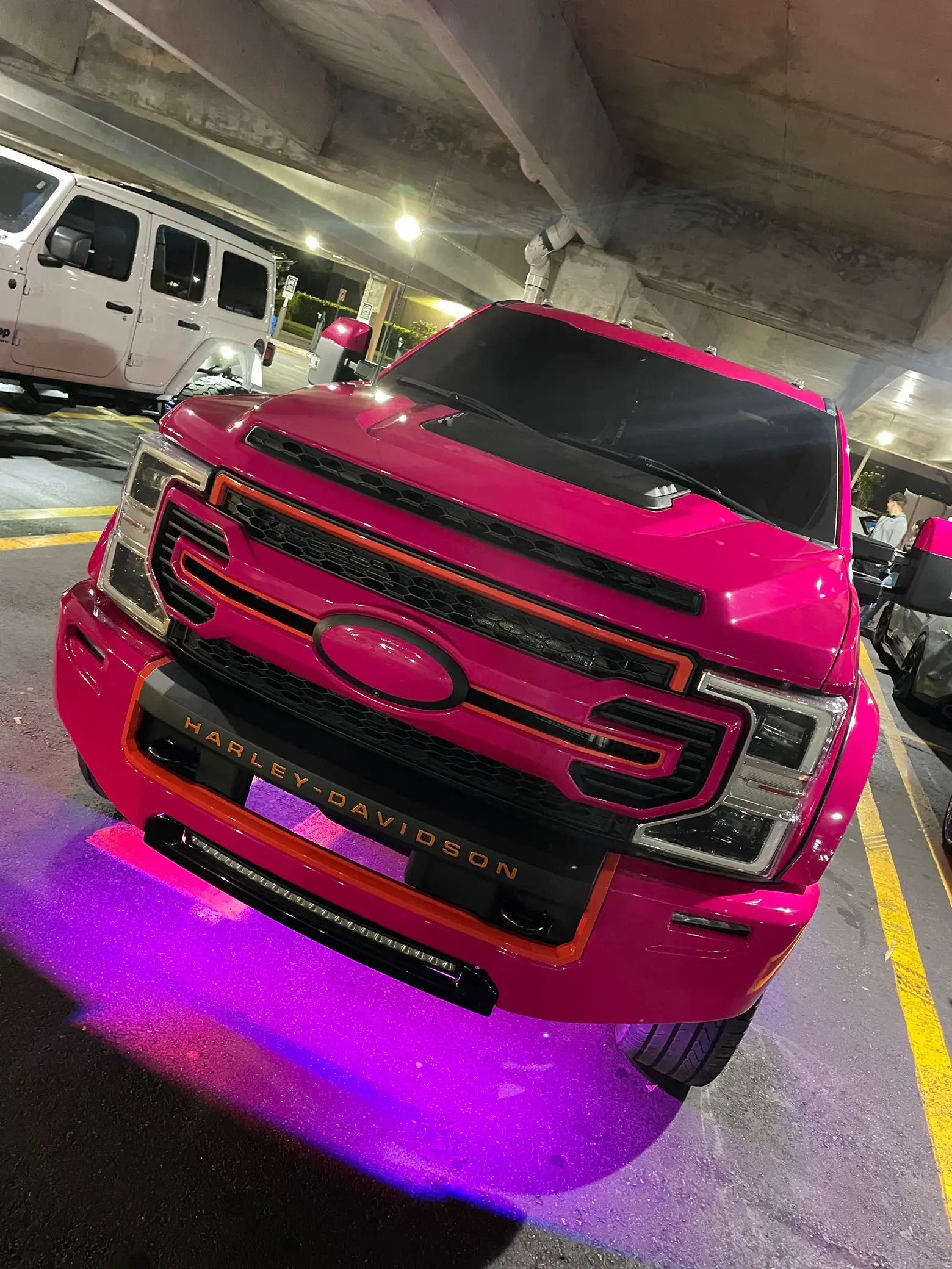 Pink Ford Truck in a Parking Lot