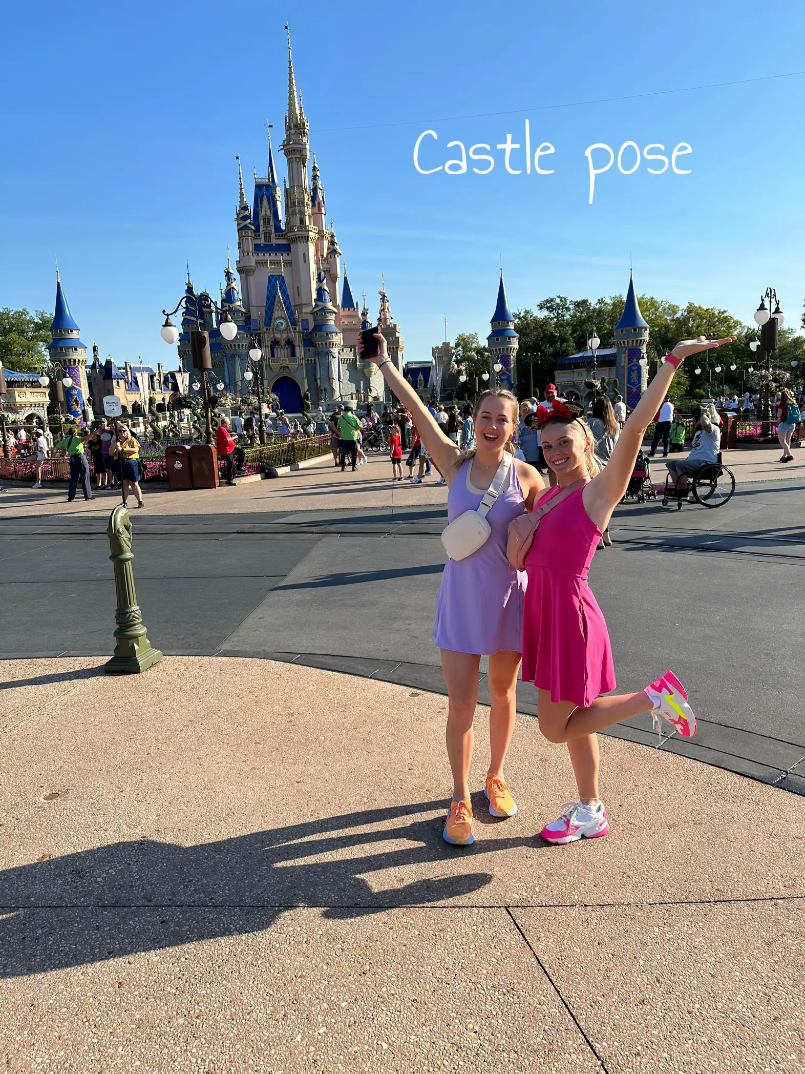  Two women are posing in front of a castle.