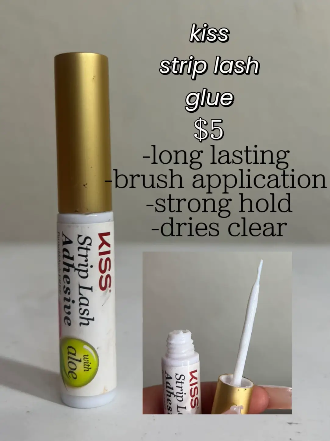  A bottle of Kiss Strip lash glue is shown with a brush