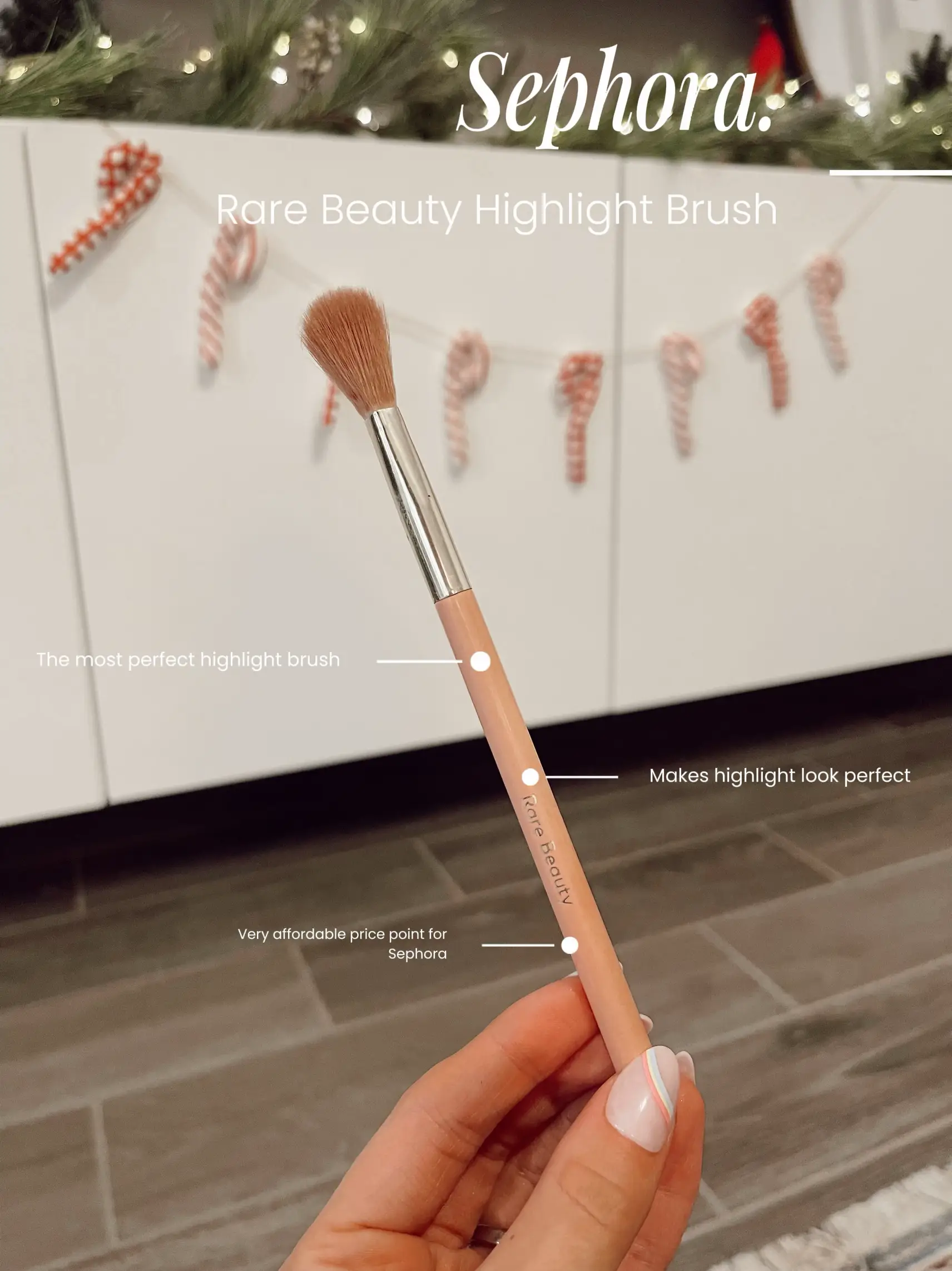  A hand holding a brush with a price of $19.00.